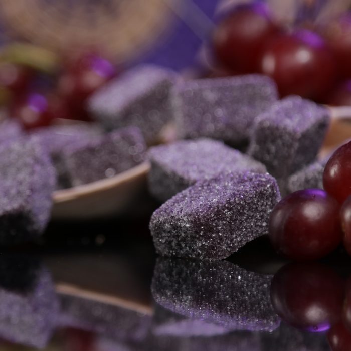 These grape gummies are nestled within real grapes.